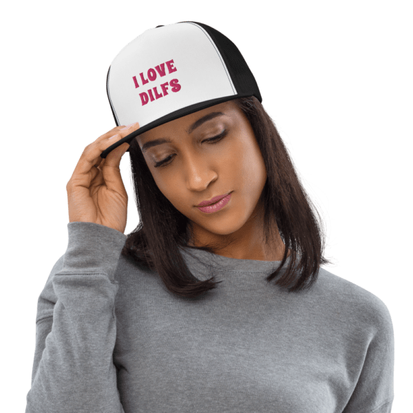 woman in i love DILFs snapback hat with pink text