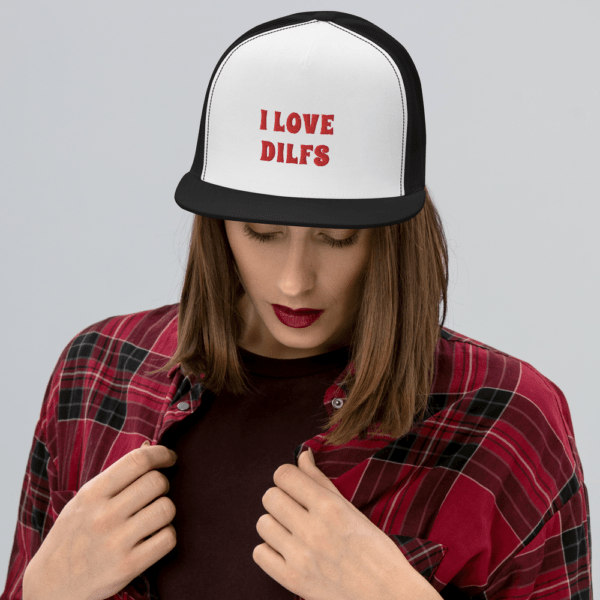 woman in i love DILFs snapback hat with red text