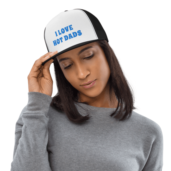 woman in i love hot dads trucker hat with blue text