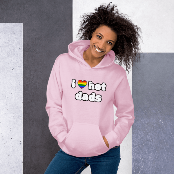 woman in i love hot dads pink hoodie with rainbow gay pride heart